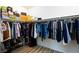 Spacious walk-in closet with ample hanging space, shelving, and stylish organization at 10095 Ferton Lake Ave, Las Vegas, NV 89178