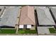 Aerial view of backyard featuring patio, putting green, and low-maintenance landscape at 10251 Tiger Milkweed St, Las Vegas, NV 89141