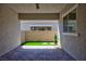 Private back patio with pavers, an artificial lawn area, and a view of the surrounding neighborhood at 10251 Tiger Milkweed St, Las Vegas, NV 89141