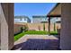 Charming backyard featuring artificial grass, and a brick patio perfect for outdoor entertaining at 10251 Tiger Milkweed St, Las Vegas, NV 89141