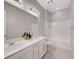Bathroom with dual sinks, vanity area, and a shower/tub combination at 10251 Tiger Milkweed St, Las Vegas, NV 89141