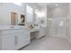 Spacious bathroom features a double vanity and a glass enclosed shower at 10251 Tiger Milkweed St, Las Vegas, NV 89141