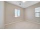 Bedroom with tile flooring and a window offering natural light at 10251 Tiger Milkweed St, Las Vegas, NV 89141