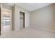 Bedroom featuring tile flooring, closet with sliding doors, and natural light at 10251 Tiger Milkweed St, Las Vegas, NV 89141