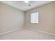 Bedroom featuring tile flooring, a window, and neutral wall color at 10251 Tiger Milkweed St, Las Vegas, NV 89141