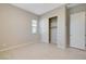 Bedroom featuring tile flooring, closet with sliding doors, and natural light at 10251 Tiger Milkweed St, Las Vegas, NV 89141