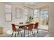 Sunlit dining area with access to the backyard, great for indoor/outdoor entertaining at 10251 Tiger Milkweed St, Las Vegas, NV 89141