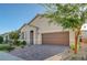 Charming single-story home featuring a well-manicured lawn, stone accents, and a welcoming front entrance at 10251 Tiger Milkweed St, Las Vegas, NV 89141