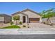 Charming single-story home with a brick driveway, two-car garage, desert landscaping, and an inviting entrance at 10251 Tiger Milkweed St, Las Vegas, NV 89141
