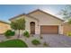 Charming single-story home with a well-maintained yard, desert landscaping, and a two-car garage at 10251 Tiger Milkweed St, Las Vegas, NV 89141