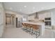 Modern kitchen with stainless steel appliances, a spacious island with seating, and plenty of cabinet space at 10251 Tiger Milkweed St, Las Vegas, NV 89141