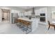 Open-concept kitchen with island and stainless steel appliances at 10251 Tiger Milkweed St, Las Vegas, NV 89141