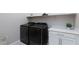 Well-equipped laundry room with modern washer and dryer, countertop, and cabinet space for convenient chores at 10251 Tiger Milkweed St, Las Vegas, NV 89141