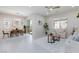 Open-concept living room and dining area with neutral tones and ample natural light at 10251 Tiger Milkweed St, Las Vegas, NV 89141