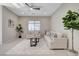 Cozy living room with neutral walls, plush sofas, and large windows providing plenty of natural light at 10251 Tiger Milkweed St, Las Vegas, NV 89141