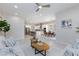 Open concept living space featuring modern kitchen, dining, and living areas at 10251 Tiger Milkweed St, Las Vegas, NV 89141