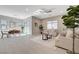 Inviting living space with a dining area and a living room filled with comfortable seating and natural light at 10251 Tiger Milkweed St, Las Vegas, NV 89141