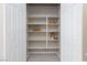 Spacious walk-in pantry featuring ample shelving space for organized storage, keeping your kitchen clutter-free at 10251 Tiger Milkweed St, Las Vegas, NV 89141
