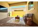 Inviting covered patio with stylish seating and decor, perfect for outdoor relaxation and entertaining at 10251 Tiger Milkweed St, Las Vegas, NV 89141