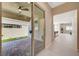 View of the outdoor patio featuring brick pavers, leading into an open floor plan with modern interior design at 10251 Tiger Milkweed St, Las Vegas, NV 89141
