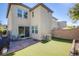 Low maintenance backyard with paved patio, artificial grass, ideal for entertaining at 104 Pollentia Ave, North Las Vegas, NV 89084