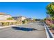 Inviting community entrance with well-manicured landscaping and decorative gate, enhancing curb appeal at 104 Pollentia Ave, North Las Vegas, NV 89084