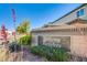 Stone sign at Aurora Heights with beautiful landscaping and bright blue sky, showcasing the community's entrance at 104 Pollentia Ave, North Las Vegas, NV 89084
