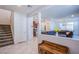 Inviting entryway leading to a cozy living room and updated kitchen, showcasing modern tile flooring at 104 Pollentia Ave, North Las Vegas, NV 89084