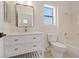 Stylish bathroom featuring modern fixtures, a large mirror, and a bathtub with shower at 10809 Clarion Ln, Las Vegas, NV 89134