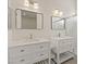 Modern bathroom with double sinks, quartz countertops, new fixtures, and stylish lighting at 10809 Clarion Ln, Las Vegas, NV 89134
