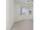Bedroom with light-colored flooring and a large window for plenty of natural light at 10809 Clarion Ln, Las Vegas, NV 89134