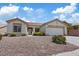 Charming single-story home featuring a low-maintenance desert landscape and attached two-car garage at 10809 Clarion Ln, Las Vegas, NV 89134