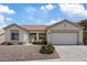 Charming single-story home featuring a low-maintenance desert landscape and attached two-car garage at 10809 Clarion Ln, Las Vegas, NV 89134