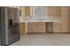 Bright kitchen features wood cabinets, stainless steel appliances, and laminate floors at 10809 Clarion Ln, Las Vegas, NV 89134