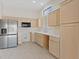 Kitchen with wood cabinets and stainless appliances at 10809 Clarion Ln, Las Vegas, NV 89134