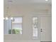 Bright living room featuring neutral paint and hardwood flooring at 10809 Clarion Ln, Las Vegas, NV 89134