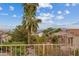 Charming community view showcasing mature landscaping, tile roofs, and distant mountain views at 10809 Clarion Ln, Las Vegas, NV 89134