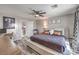 Well-lit bedroom with a desk, a comfortable bed, and stylish decor for a functional living space at 11143 Castellane Dr, Las Vegas, NV 89141