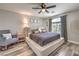Comfortable bedroom featuring a platform bed, sitting chair, and patterned curtains for added style at 11143 Castellane Dr, Las Vegas, NV 89141