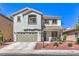 Charming two-story home with a well-maintained front yard and a two car garage at 11143 Castellane Dr, Las Vegas, NV 89141