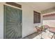 Inviting front door with a charming seating area, perfect for relaxing outdoors at 11143 Castellane Dr, Las Vegas, NV 89141