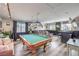 Entertainment room featuring a pool table, bar area, and comfortable seating for social gatherings at 11143 Castellane Dr, Las Vegas, NV 89141