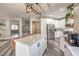 Open concept kitchen features a spacious island, stainless steel appliances, and ample cabinet space at 11143 Castellane Dr, Las Vegas, NV 89141