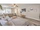 Comfortable living room with stylish decor, large sectional sofa, and a modern entertainment center at 11143 Castellane Dr, Las Vegas, NV 89141