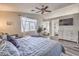 Spacious main bedroom with a comfortable bed, large window, and en-suite bathroom at 11143 Castellane Dr, Las Vegas, NV 89141