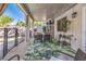 Inviting outdoor patio area with dining table, leafy rug, lighting, and pool views perfect for relaxation and entertainment at 11143 Castellane Dr, Las Vegas, NV 89141