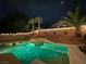 Inviting backyard pool with jacuzzi is brightly lit with string lights, offering an ideal outdoor oasis at 11143 Castellane Dr, Las Vegas, NV 89141