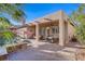 The backyard boasts a covered patio and a sparkling pool, perfect for outdoor relaxation and entertainment at 11369 Rancho Villa Verde Pl, Las Vegas, NV 89138