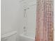 Bathroom with a bathtub and shower combination and a white toilet at 11369 Rancho Villa Verde Pl, Las Vegas, NV 89138