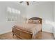 Bedroom with a wooden bed and window with white shutters at 11369 Rancho Villa Verde Pl, Las Vegas, NV 89138